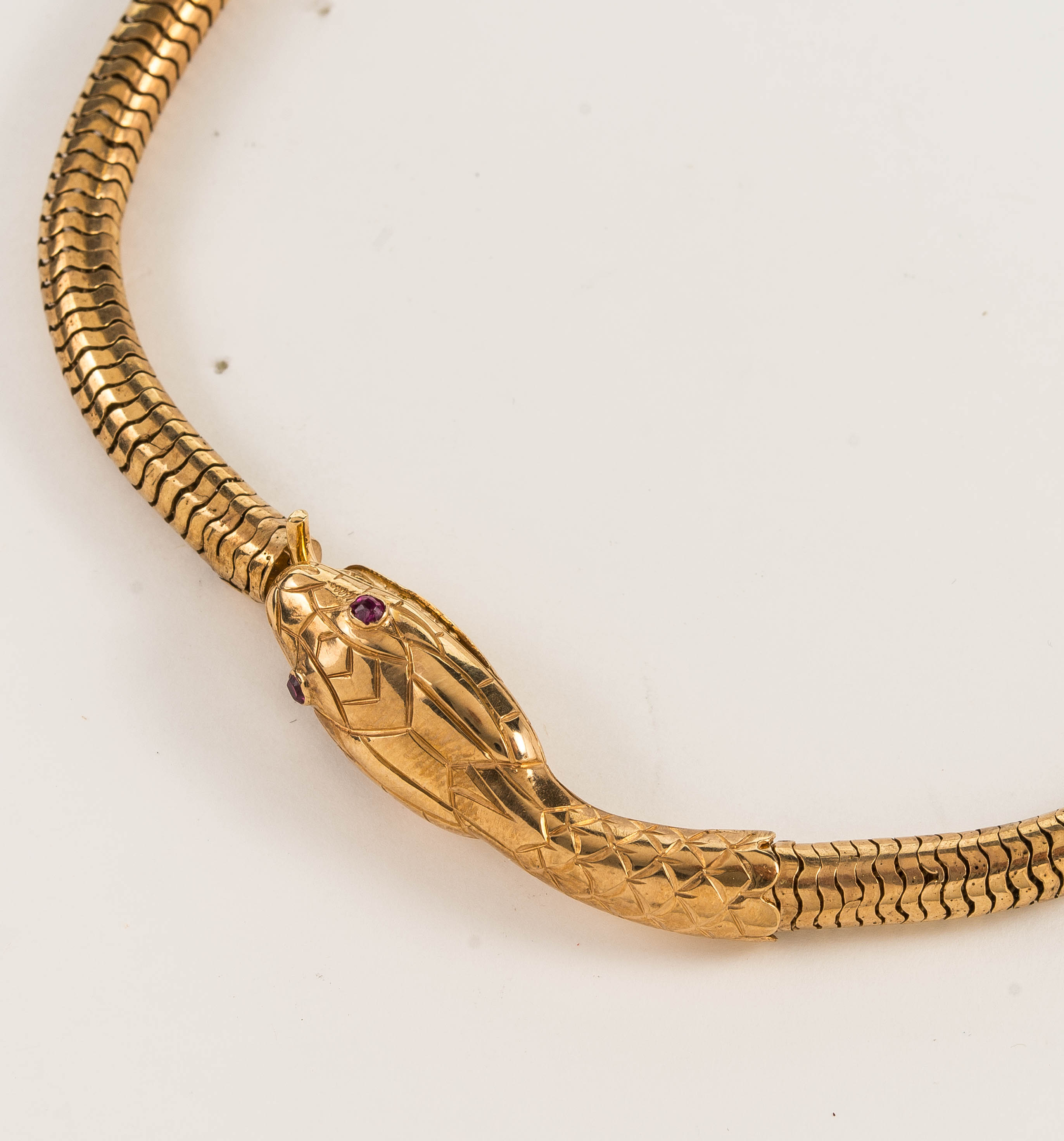 An antique gold and ruby eye snake necklace, length 43cm, Wt. 28.3g. - Image 2 of 2