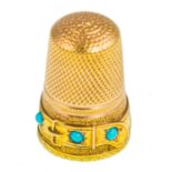 An antique gold and turquoise thimble, 23mm high, weight 4.9g.