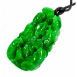 A large carved jadeite pendant, length 7cm Wt. 80.8g.