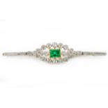 An antique gold diamond and emerald brooch, in a fitted case, emerald 1.31ct, length 6.2cm, Wt. 5.