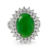 An 18ct gold certificated no treatment jadeite and diamond ring. Ring size L ½ Dia. Wt. 1.2ct.
