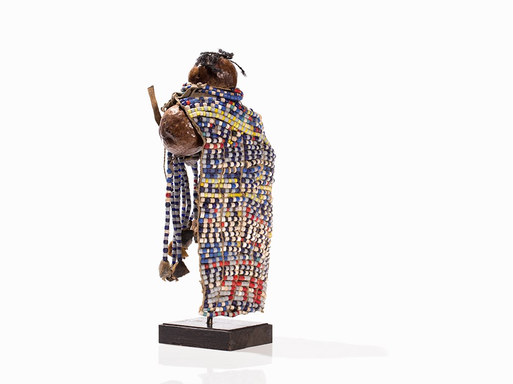 Turkana, Doll ‘Ngide’, Kenya  Palm nut, leather, beads, hair Turkana peoples, Kenya Abstracted