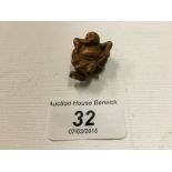 A small netsuke of a man dancing 30 mm.