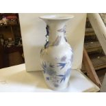 A large blue and white Lladro vase with