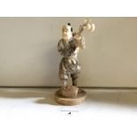 A bone Japanese figure of a fisherman ca