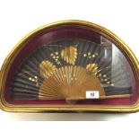 A cased ladies hand fan.