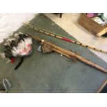 A bow and quiver with arrows and a tomah