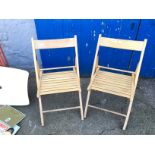 Two folding wooden chairs