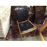 A set of four oak chairs upholstered in