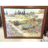 A large Monet print, with cracked glass.