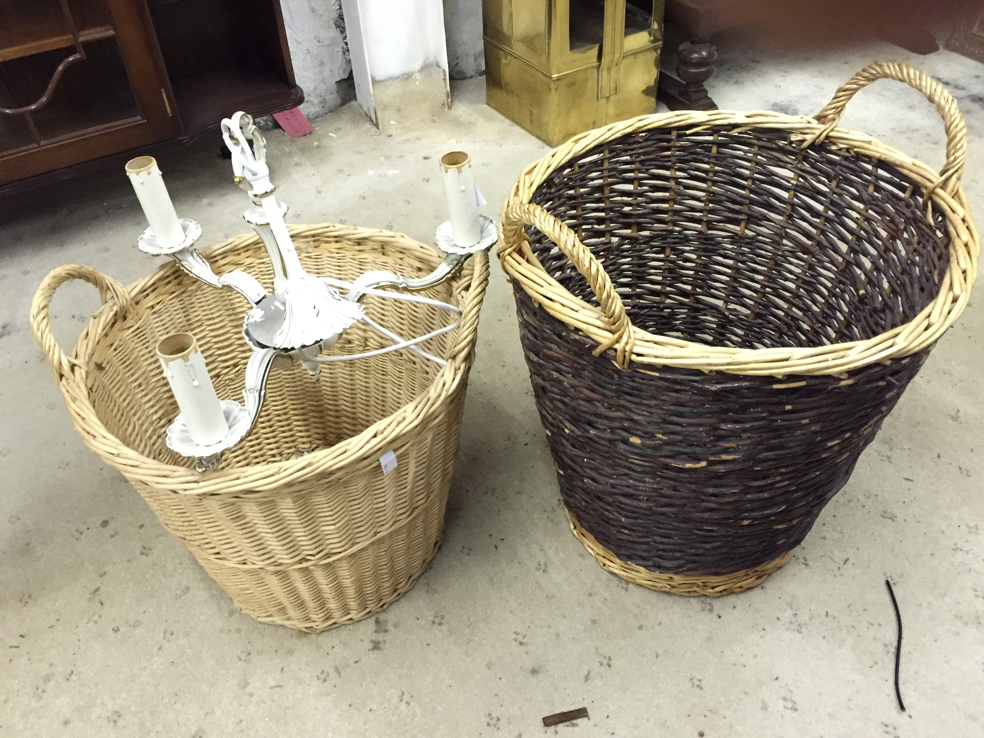 Two wicker baskets and a light fitting.