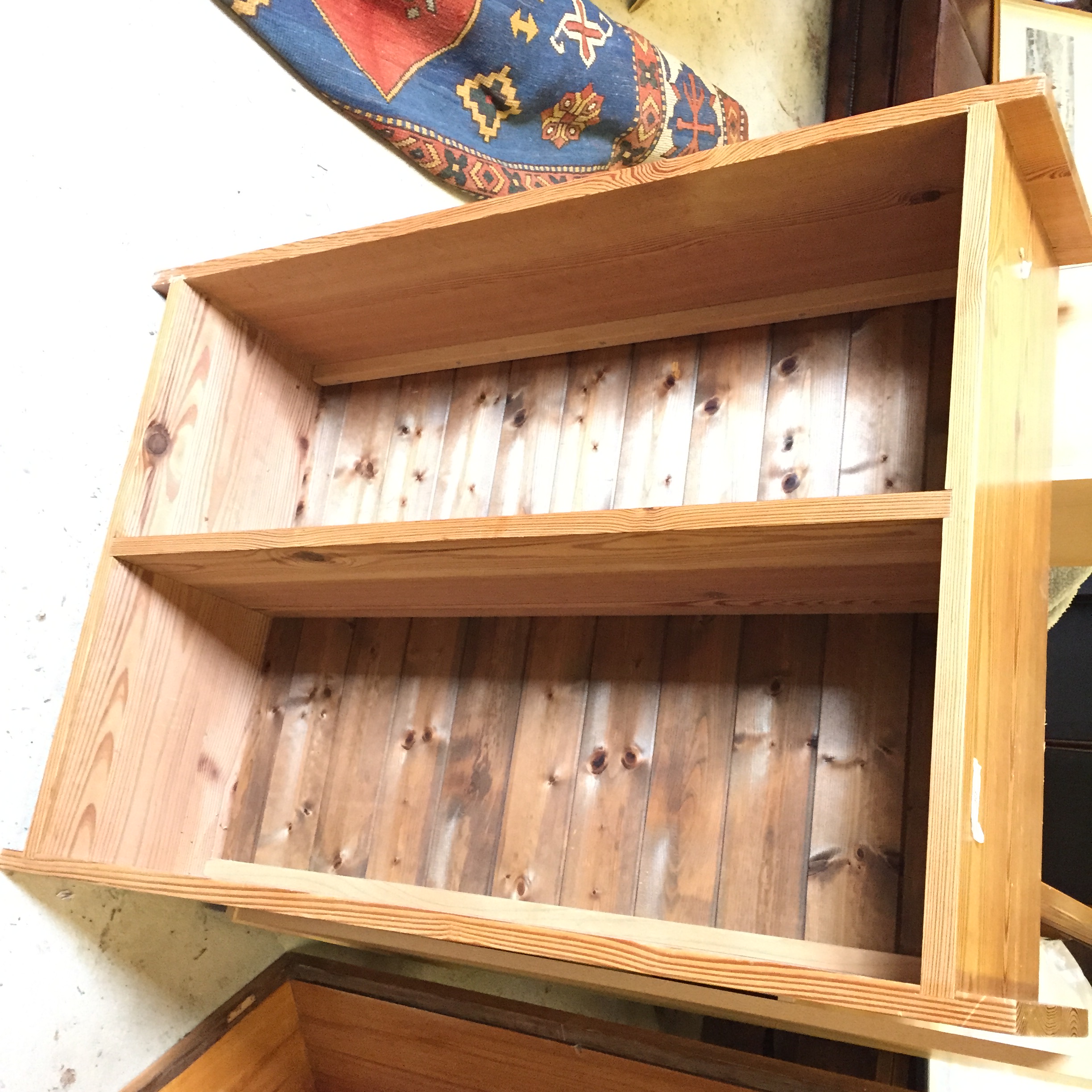 A pine wall mounted bookcase.