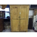 A large Victorian double pine wardrobe.