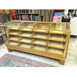 A haberdashery unit with 16 drawers glas