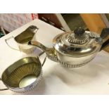 A silver plate tea pot sugar bowl and mi