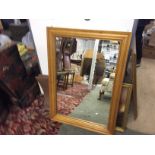 A large pine framed mirror.750 mm by 950