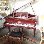 A Steinberg baby grand pianoforte.