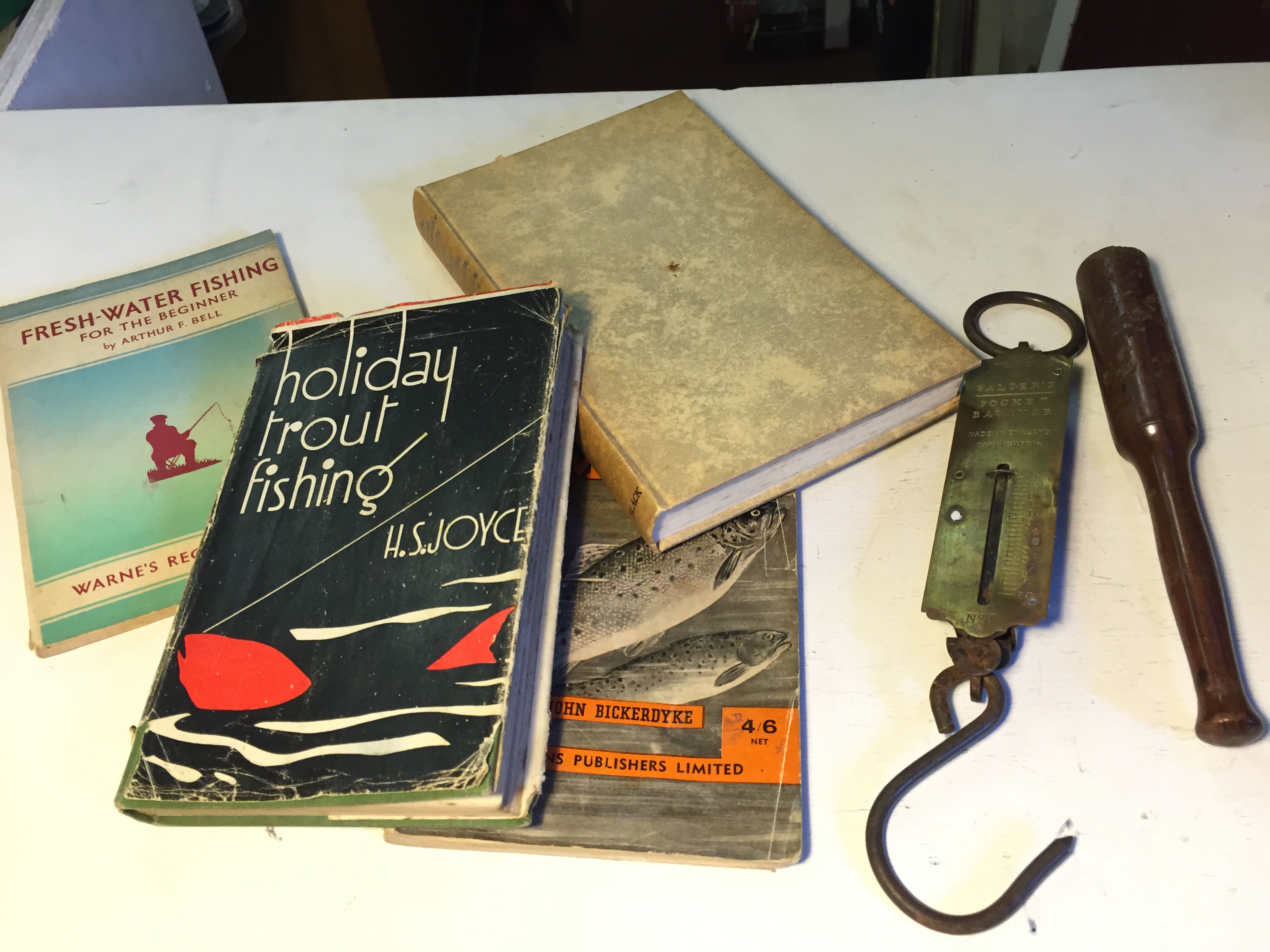 A selection of fishing books a priest and Salter's weighing scale.24