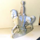 A large Lladro figure of a lady riding a horse 440 mm