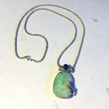 A white metal chain and white metal mount with a chrysophrase and lapizlazuli