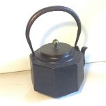 A Japanese tea kettle labled 20th century believed to be earlier.