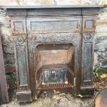 A cast iron fire suround with mantle.