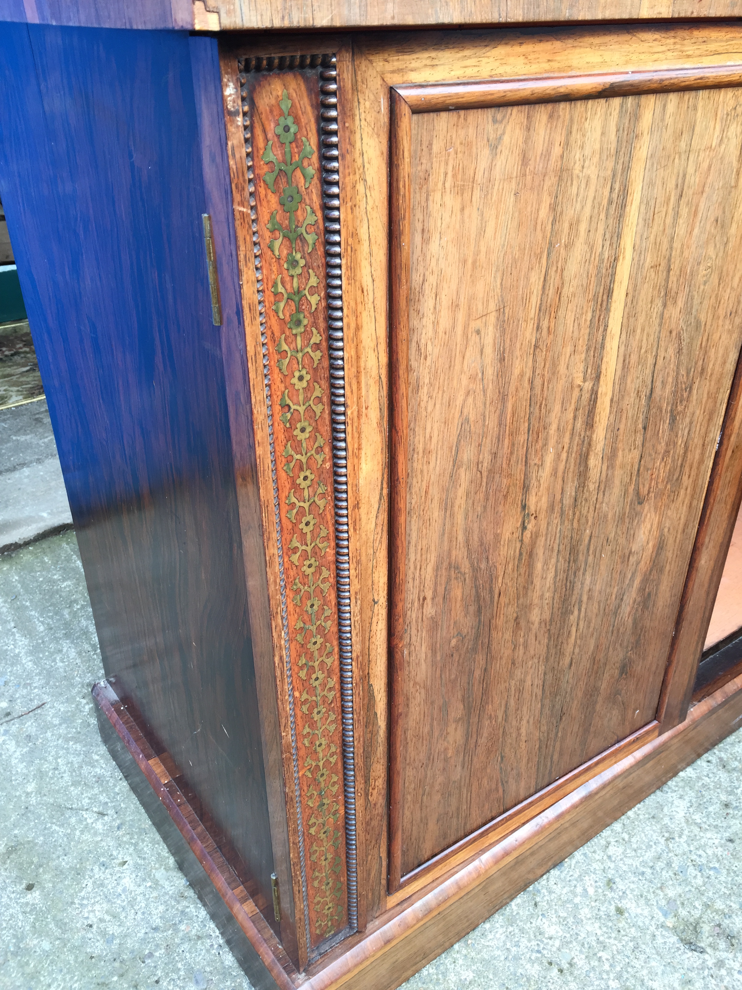 A large bookcase cabinet inlaid with brass and having ratcheted shelves and cupboards below 1220 - Image 6 of 9