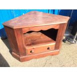 A pine corner cabinet.