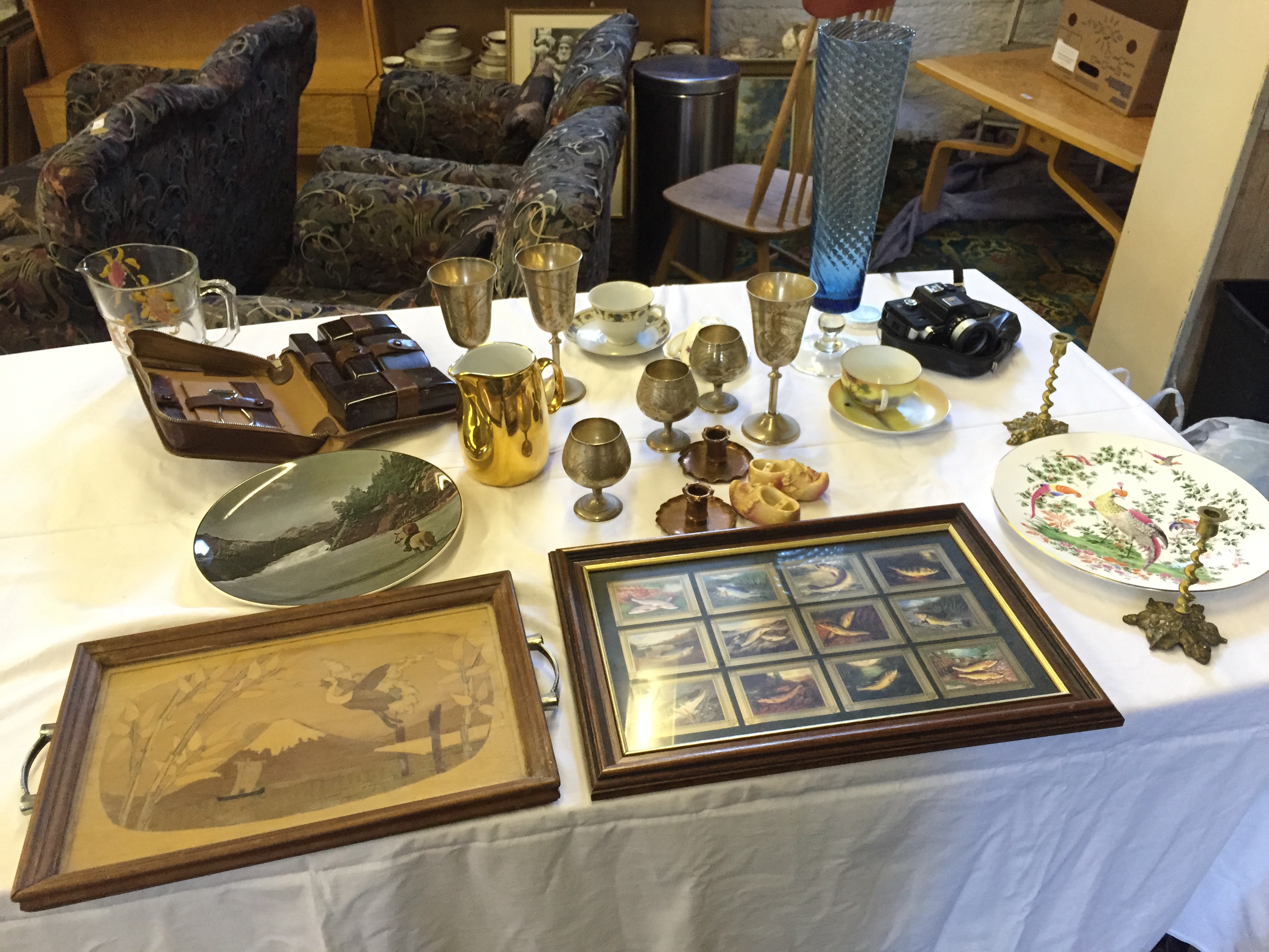 A general selection of items including a tea tray silver plate goblets and others.