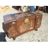 A carved camphor wood blanket box.