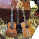 Three guitars one being a Juan Estruch classical twelve string vintage guitar