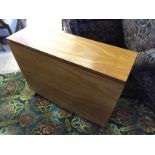 A teal drop leaf table