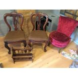 *A pair of Victorian mahogany balloon backed chairs a nursing chair and a magazine rack.