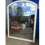 A very large curved top mirror with slight desilvering measuring 1970 mm H by 1500 mm w