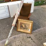 *Two decorative prints an arm chair an a rotary clothes dryer.