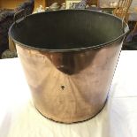 A copper log bin