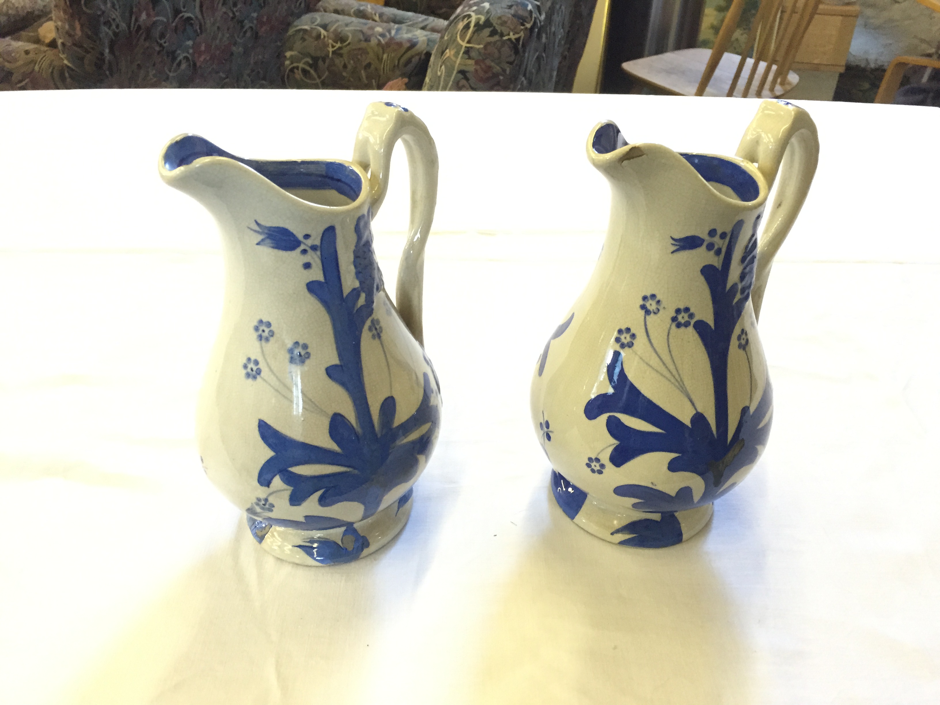 A pair of ceramic blue and white jugs.