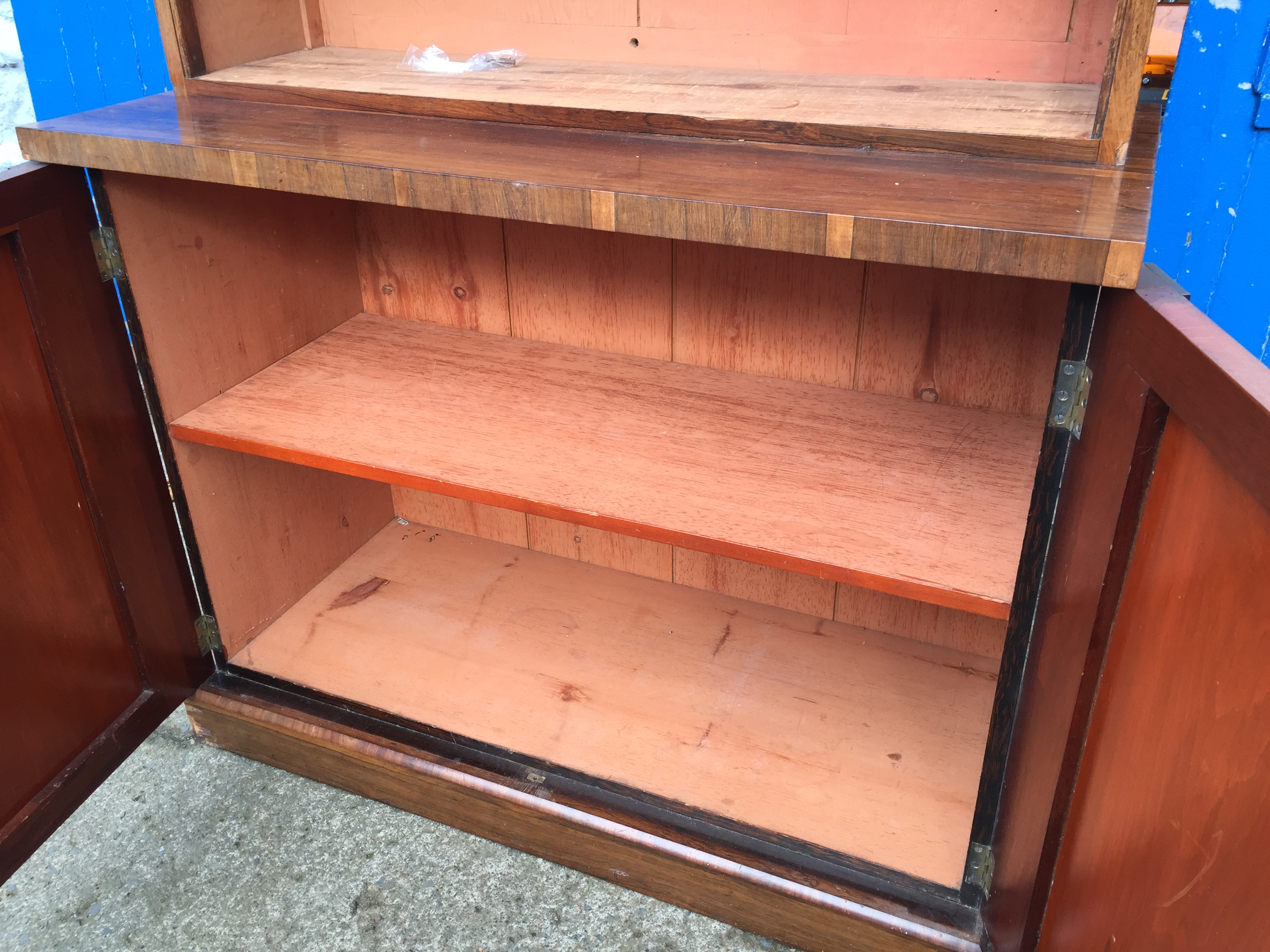 A large bookcase cabinet inlaid with brass and having ratcheted shelves and cupboards below 1220 - Image 9 of 9