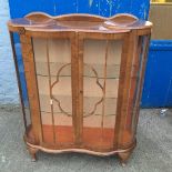 A stylized 1950's China cabinet.