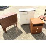 *A 60's formica topped kitchen unit a bedside chest and a drop leaf table.