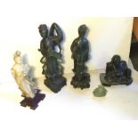 A group of four jade figures.