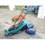 *An electric Bosch Rotak 34 lawn mower and a good selection of hand tools including a metal tool