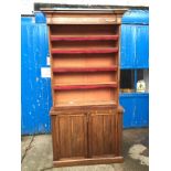 A large bookcase cabinet inlaid with brass and having ratcheted shelves and cupboards below 1220