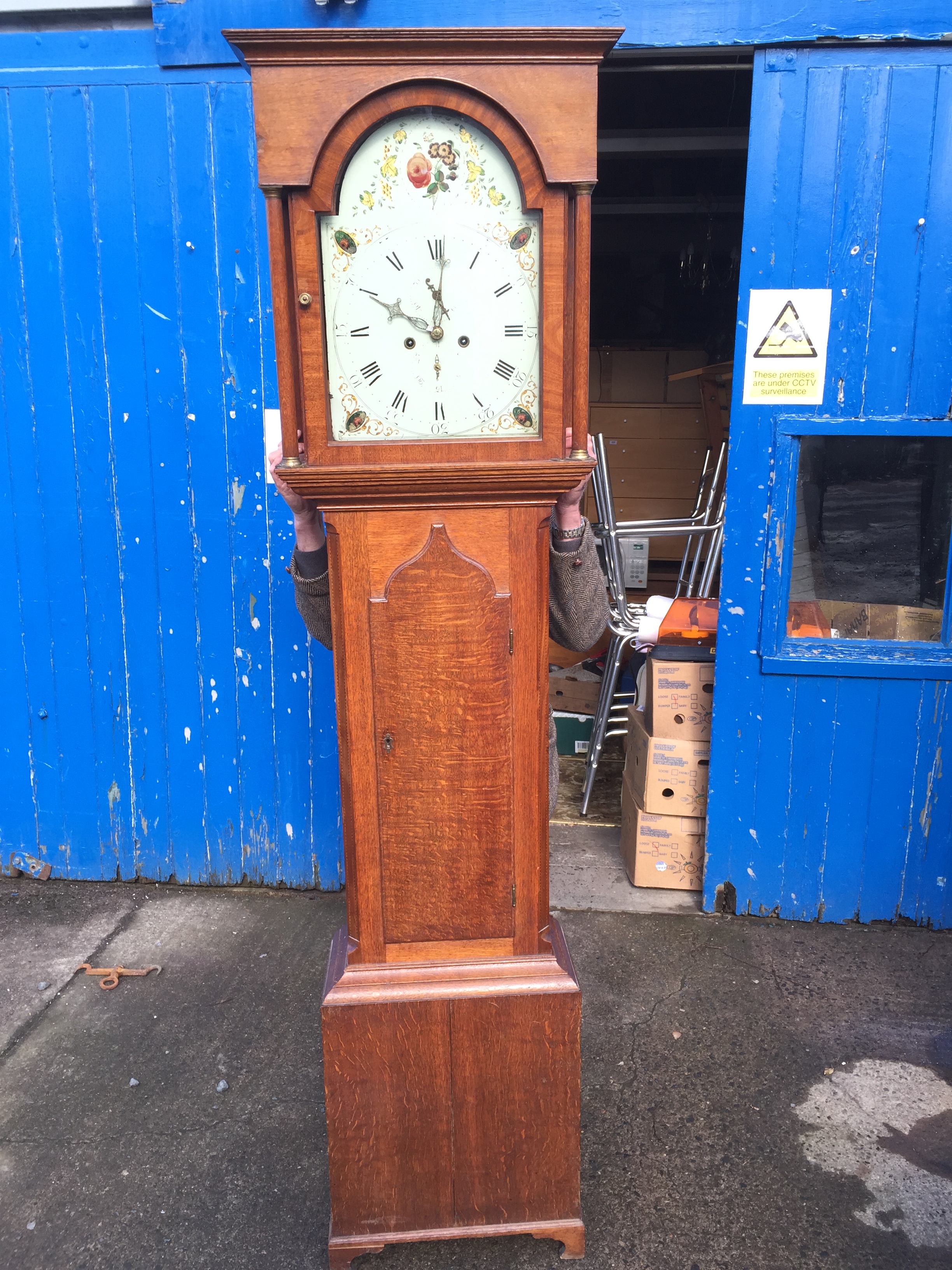 A long case grandfather clock.