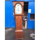 A long case grandfather clock.