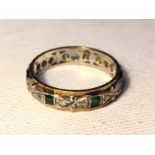 A diamond and emerald ring one emerald inset missing. 3.4 g