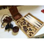 A chess, draughts and backgammon set a set of cased binoculars and others.