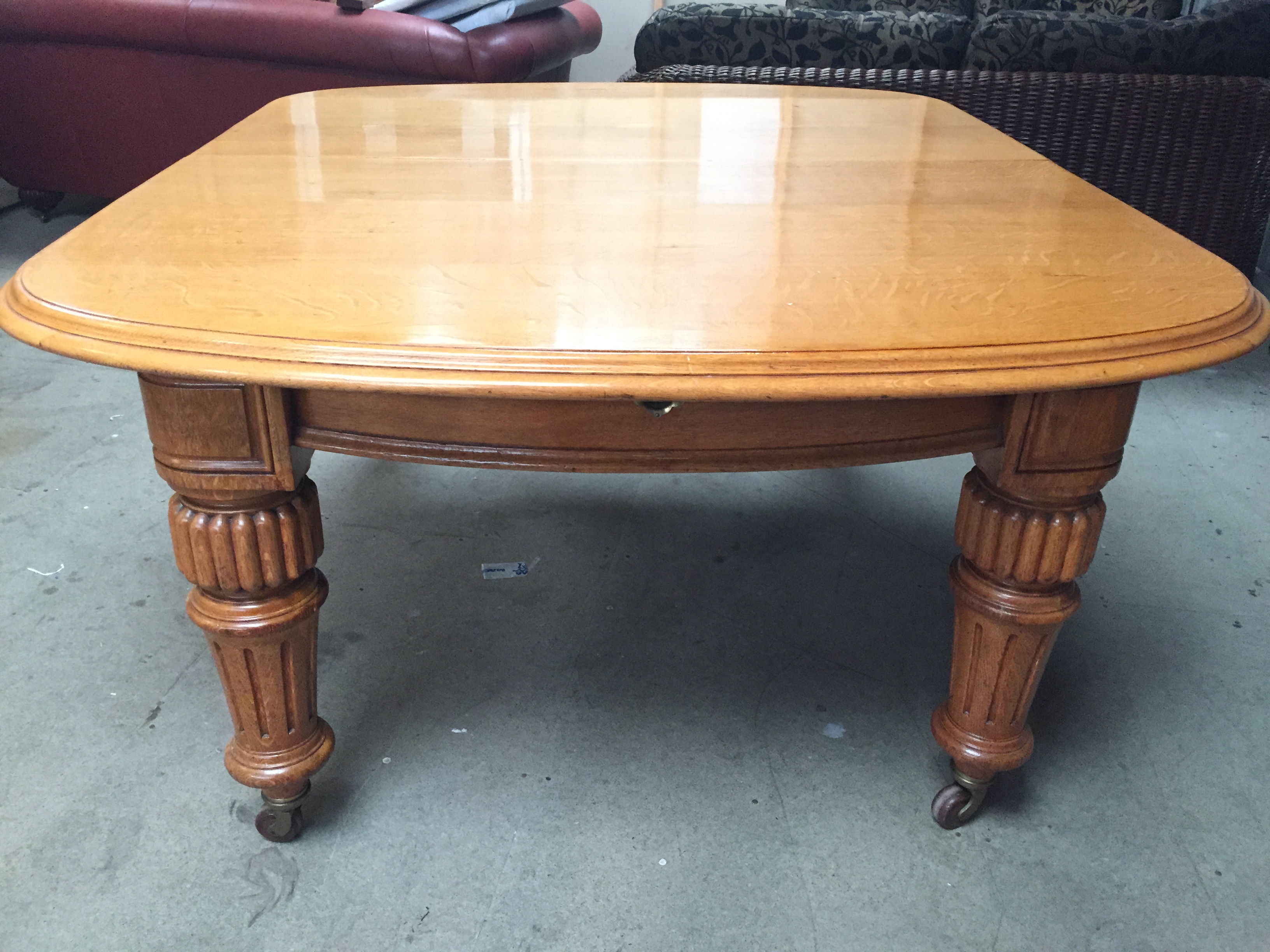 * A large Victorian light oak extending table with winding mechanism. - Image 3 of 4