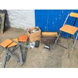 Four Ikea Stools and a box of tapes and talking books.