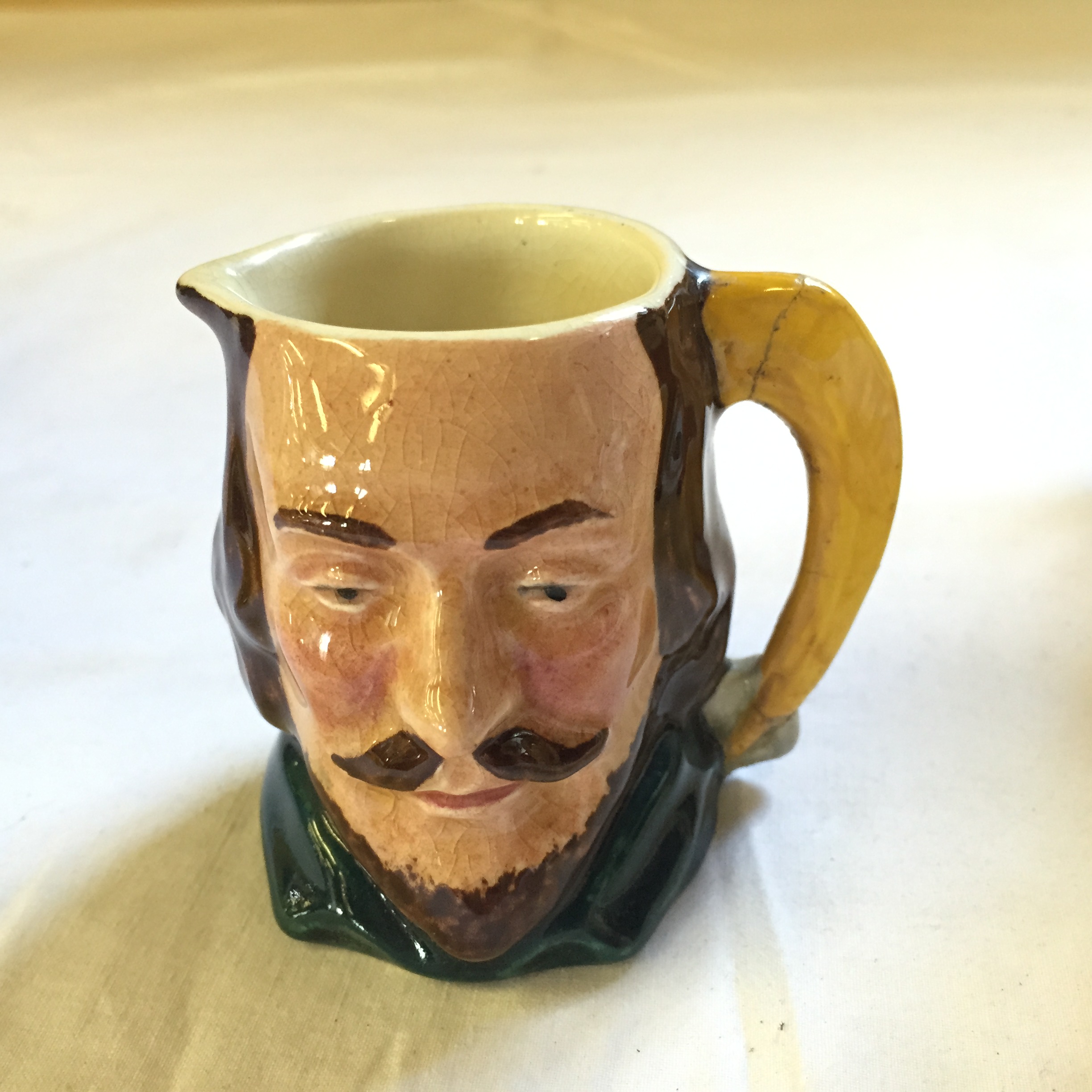 Two Goebel tankards a Shorrter and Son tea pot and a Sandland Toby Jug with cracked handle. - Image 5 of 9